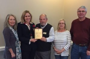 Plaque presented to Michelle Griffin, Chair of the Ocean Isle Beach Flotilla and Debbie Tucker OIB Flotilla committee member by Mr. Bill Hadesty, BFA Chairman; Steve Long Vice Chairman and Sue Brandon, Secretary